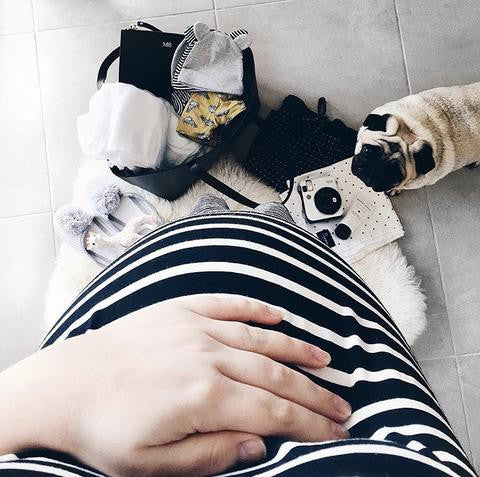 Pregnant woman packing hospital bag
