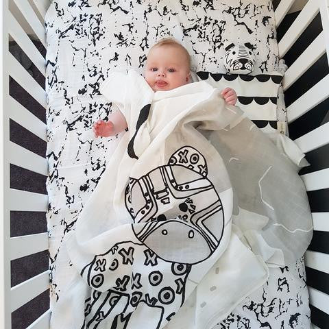 Baby in Dash Kippin muslin wrap