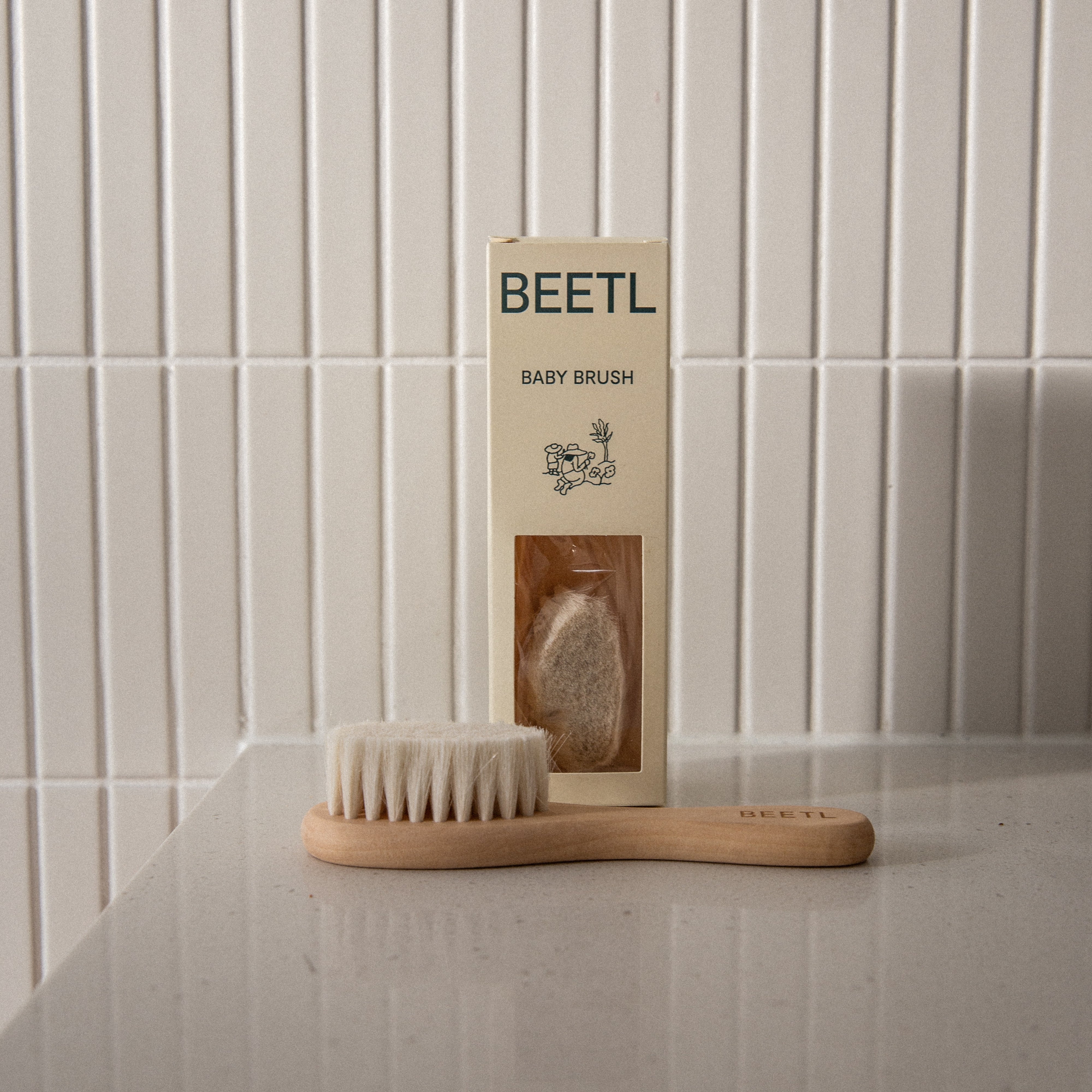 BEETL Baby Brush with soft bristles and ergonomic handle, designed for gentle hair and scalp cleaning for infants.