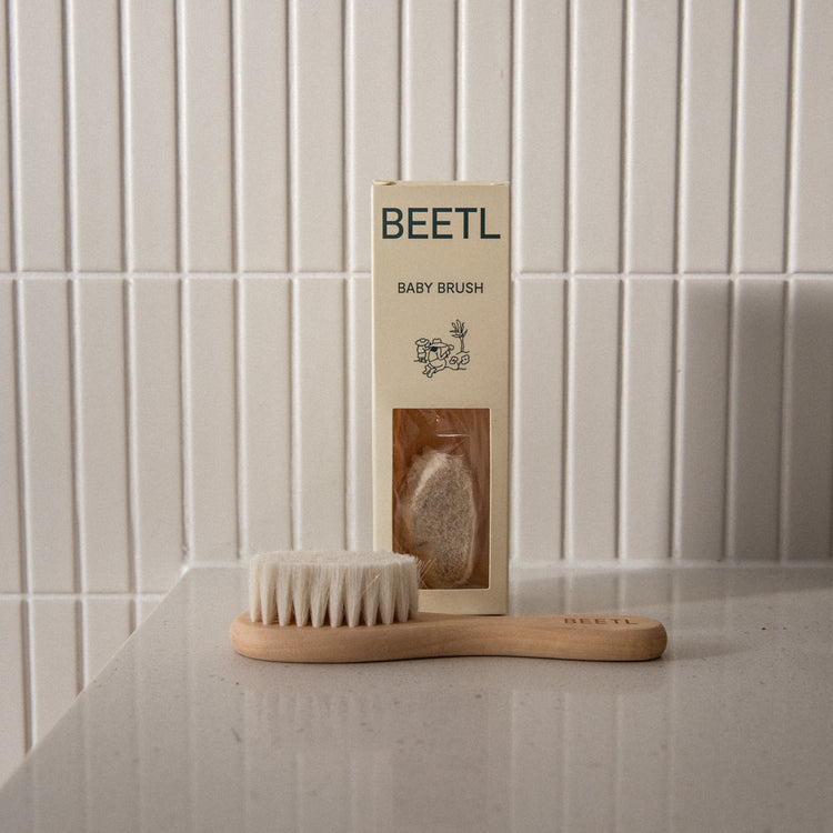 BEETL Baby Brush with soft bristles and ergonomic handle, designed for gentle hair and scalp cleaning for infants.