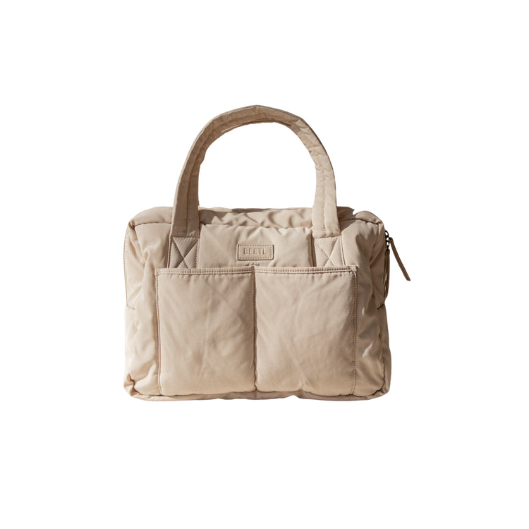 BEETL Baby Bag in cream color, stylish and spacious bag with multiple compartments for parents and baby essentials.