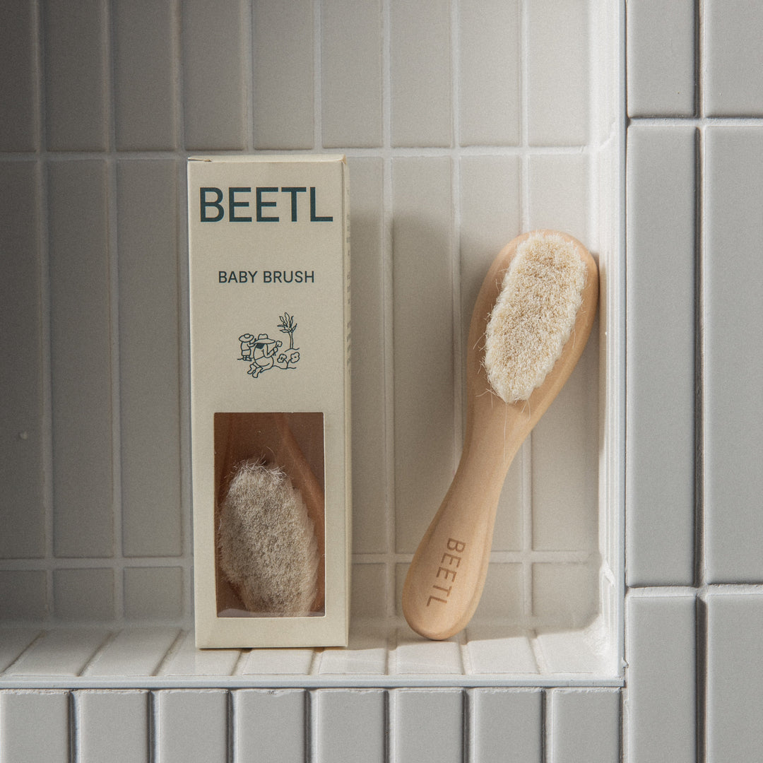 BEETL Baby Brush with soft bristles and ergonomic handle, designed for gentle hair and scalp cleaning for infants.