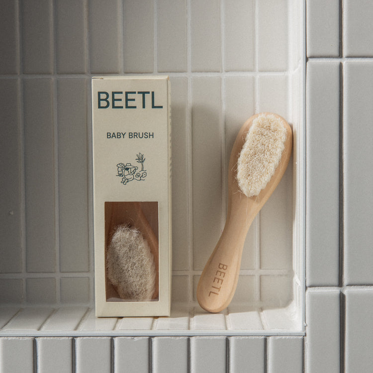 BEETL Baby Brush with soft bristles and ergonomic handle, designed for gentle hair and scalp cleaning for infants.