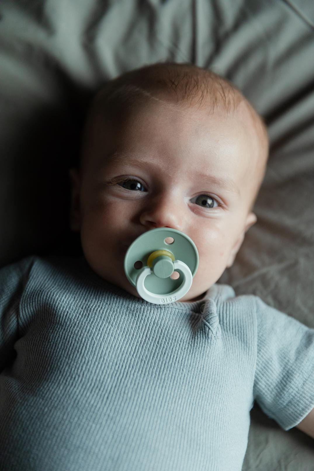 BIBS GLOW pacifiers in blush and vanilla, round latex design, 0+ months, 2-pack for soothing comfort.