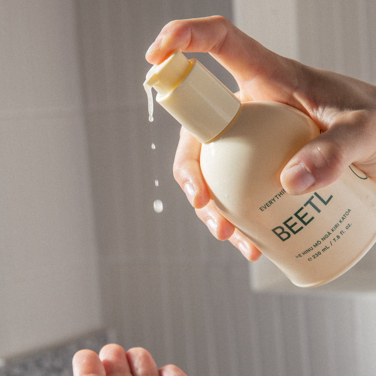 BEETL Everything Oil 230ml bottle with black screw cap, clear glass container showcasing the versatile oil for skincare and haircare.