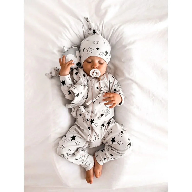 Kippins Star Organic Knot Beanie for babies, soft fabric, featuring a star pattern, in a cozy, snug fit for infants.