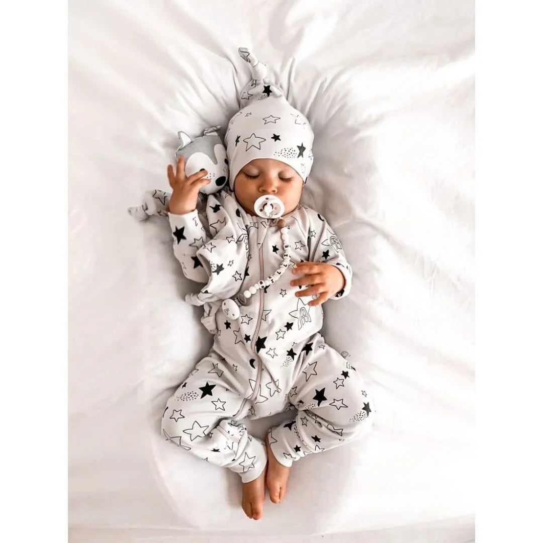 Kippins Star Organic Knot Beanie for babies, soft fabric, featuring a star pattern, in a cozy, snug fit for infants.